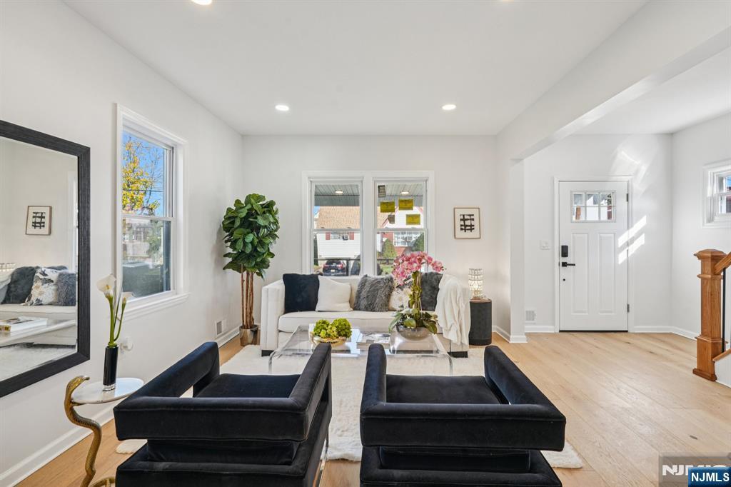 51 Highland Place Ridgefield Park, NJ 07660 - Photo 5 of 35 a living room with furniture and a potted plant