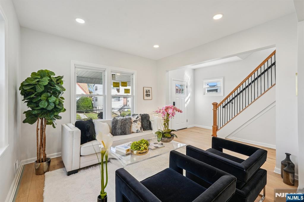 51 Highland Place Ridgefield Park, NJ 07660 - Photo 6 of 35 a living room with furniture and a potted plant