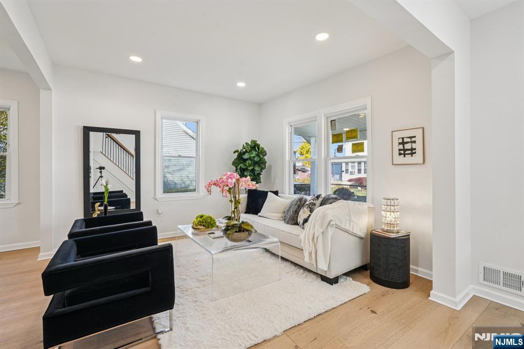 51 Highland Place Ridgefield Park, NJ 07660 - Photo 8 of 35 a living room with furniture and a stairs