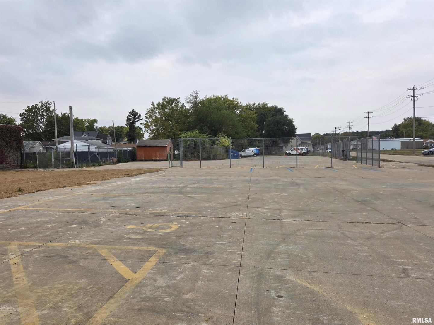 112 North 2nd Street Clinton, IA 52732 - Photo 4 of 5 a view of swimming pool with outdoor seating and green space