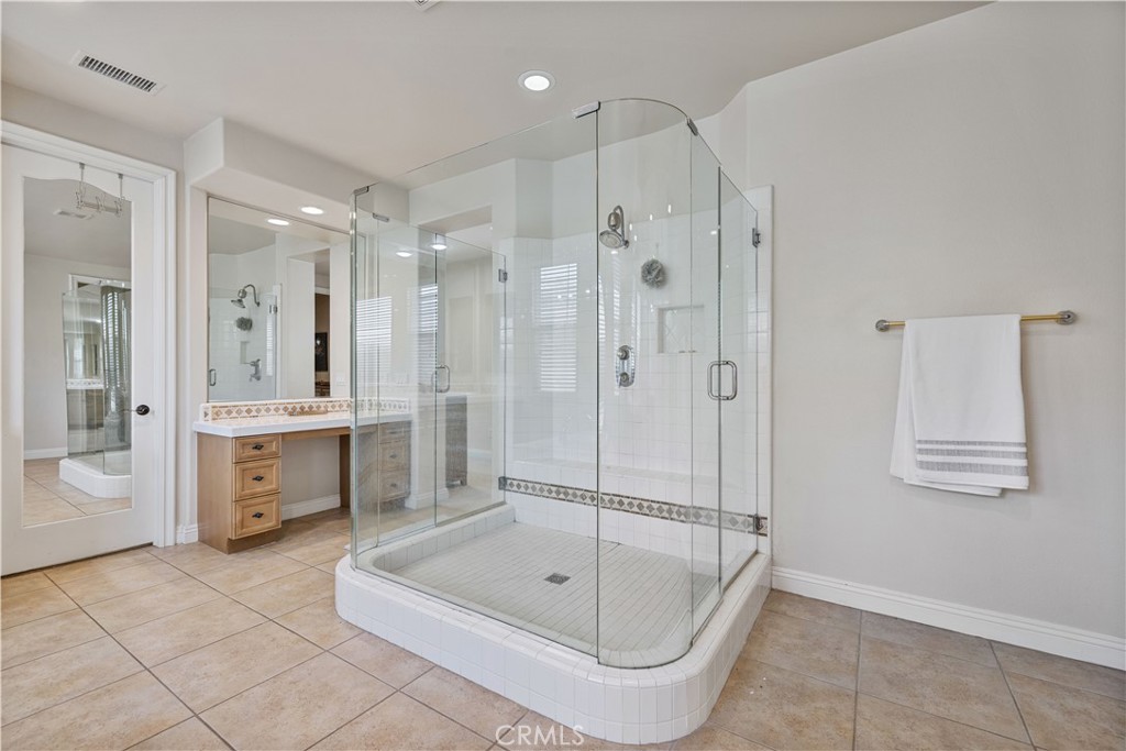4959 Shady Trail Street Simi Valley, CA 93063 - Photo 20 of 40 a bathroom with a tub a sink and a shower