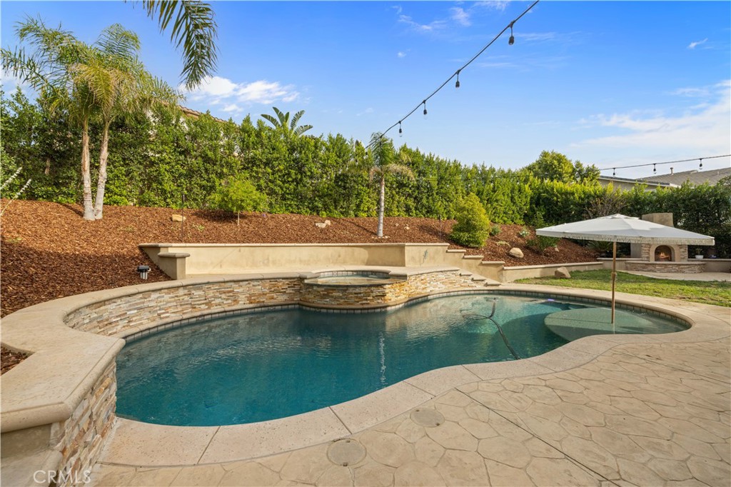 4959 Shady Trail Street Simi Valley, CA 93063 - Photo 2 of 40 a view of a swimming pool with a yard
