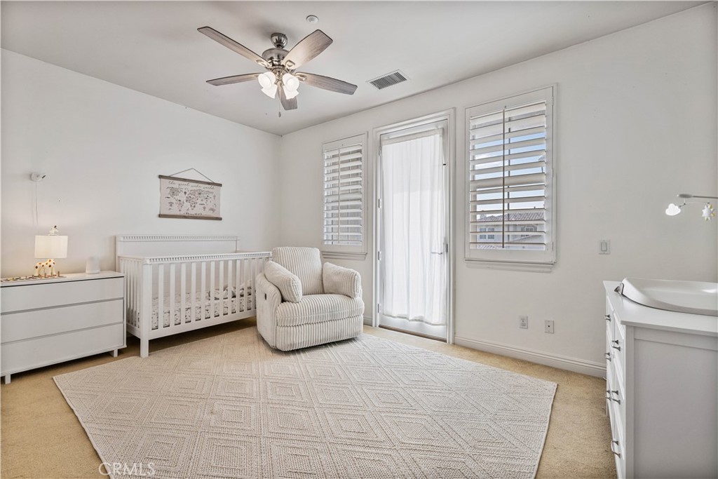 4959 Shady Trail Street Simi Valley, CA 93063 - Photo 22 of 40 a bedroom with furniture and window