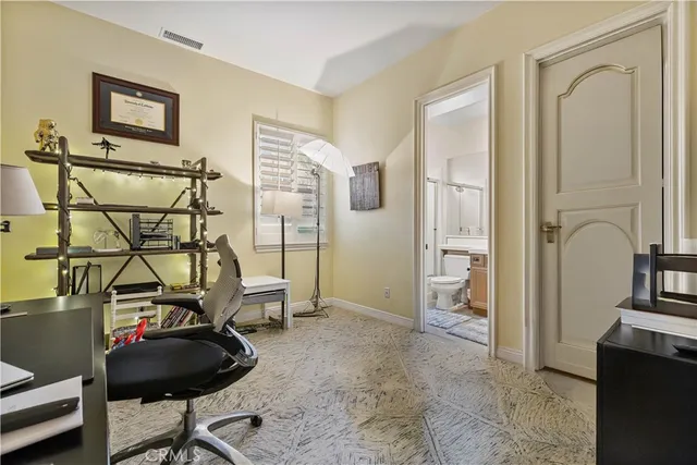 a view of a livingroom with furniture and gym equipment