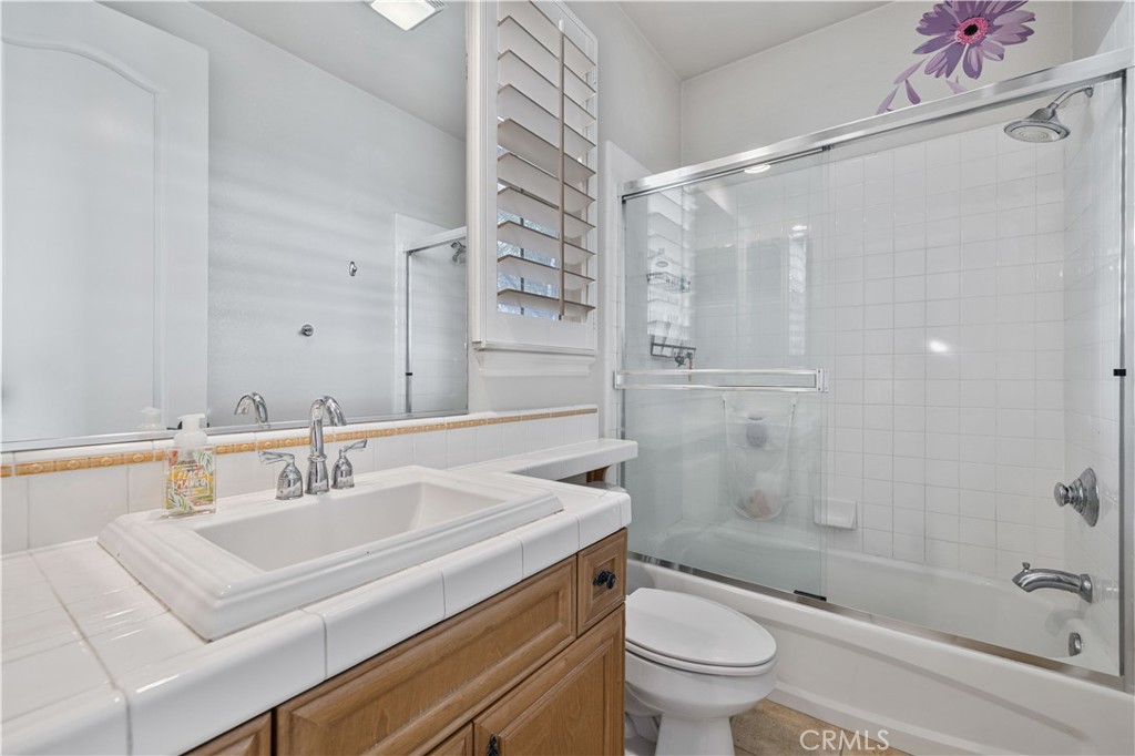 4959 Shady Trail Street Simi Valley, CA 93063 - Photo 25 of 40 a bathroom with a sink toilet vanity and shower