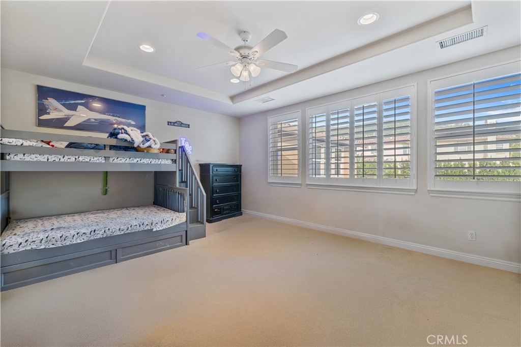 4959 Shady Trail Street Simi Valley, CA 93063 - Photo 28 of 40 a living room with furniture and a chandelier