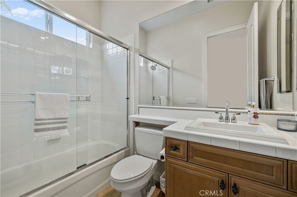 4959 Shady Trail Street Simi Valley, CA 93063 - Photo 29 of 40 a bathroom with a sink toilet and shower