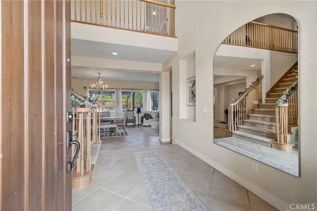 a view of entryway and hall with dining area