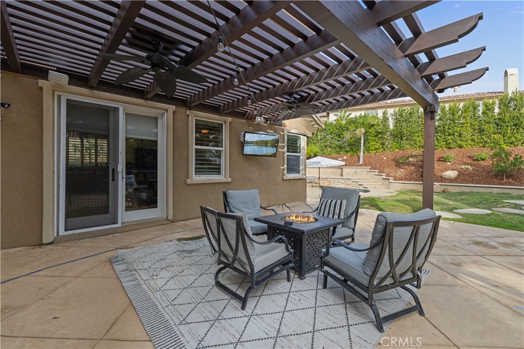 4959 Shady Trail Street Simi Valley, CA 93063 - Photo 32 of 40 a patio view with a table and chairs