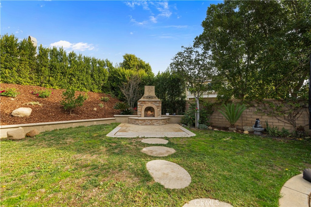 4959 Shady Trail Street Simi Valley, CA 93063 - Photo 34 of 40 a swimming pool with some trees in the background
