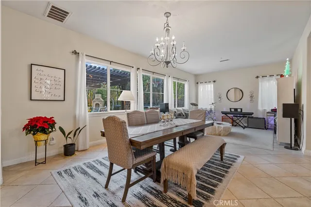 a view of a livingroom with furniture window and wooden floor