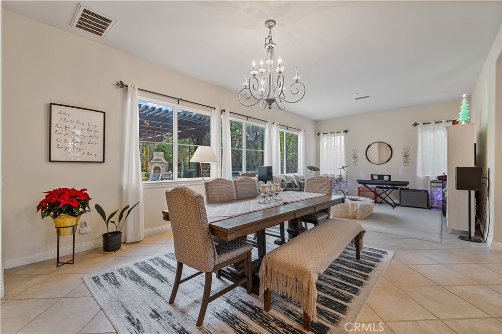 4959 Shady Trail Street Simi Valley, CA 93063 - Photo 5 of 40 a view of a livingroom with furniture window and wooden floor