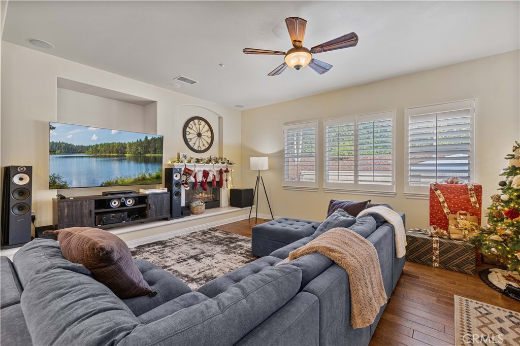 4959 Shady Trail Street Simi Valley, CA 93063 - Photo 7 of 40 a living room with furniture a large window and a flat screen tv