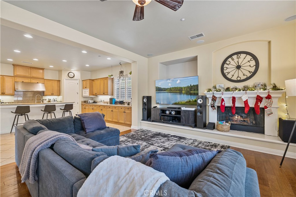 4959 Shady Trail Street Simi Valley, CA 93063 - Photo 9 of 40 a living room with furniture and a view of kitchen