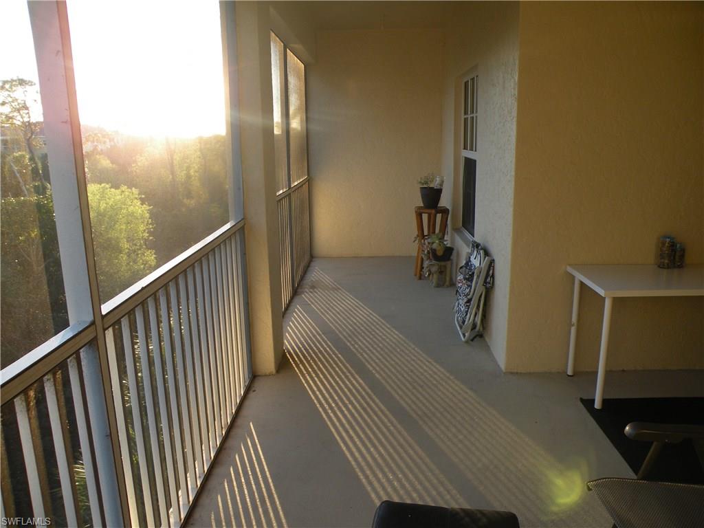 4440 Botanical Pl Circle, Unit 404 Naples, FL 34112 - Photo 7 of 11 a view of a balcony