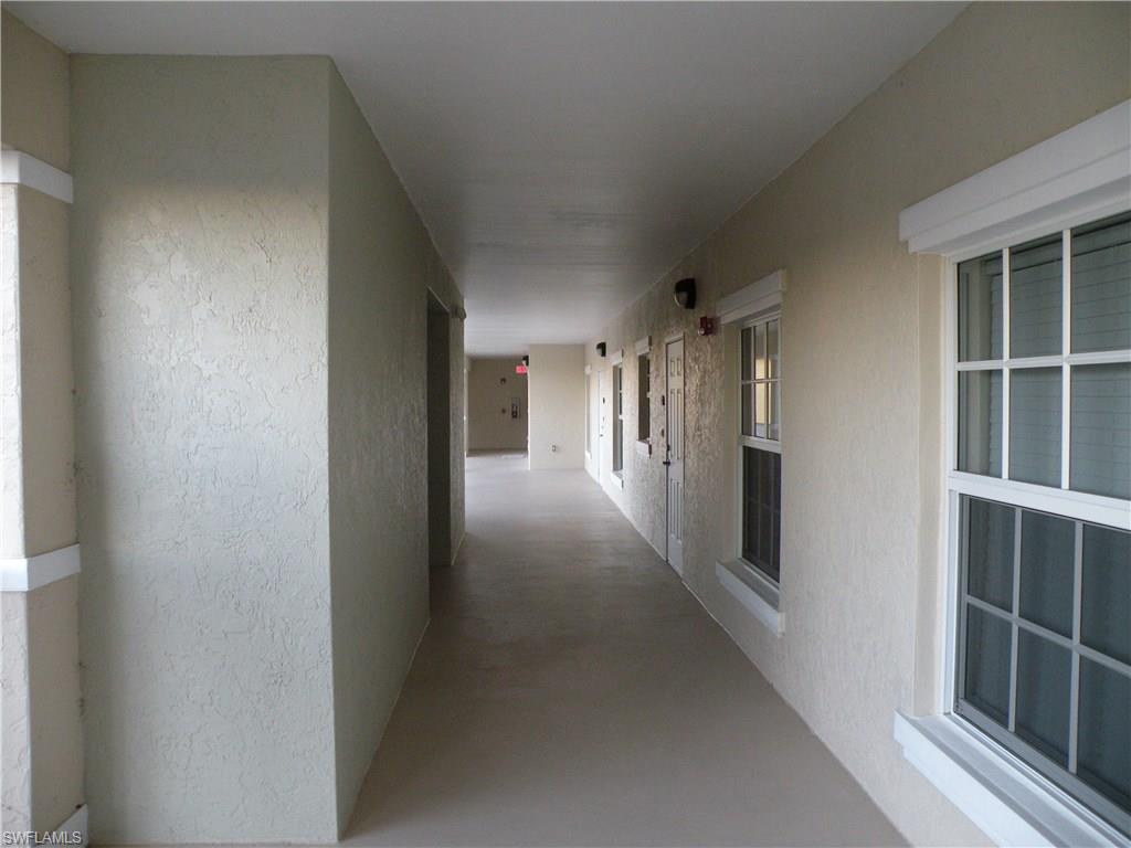 4440 Botanical Pl Circle, Unit 404 Naples, FL 34112 - Photo 9 of 11 a view of gallery with hallway