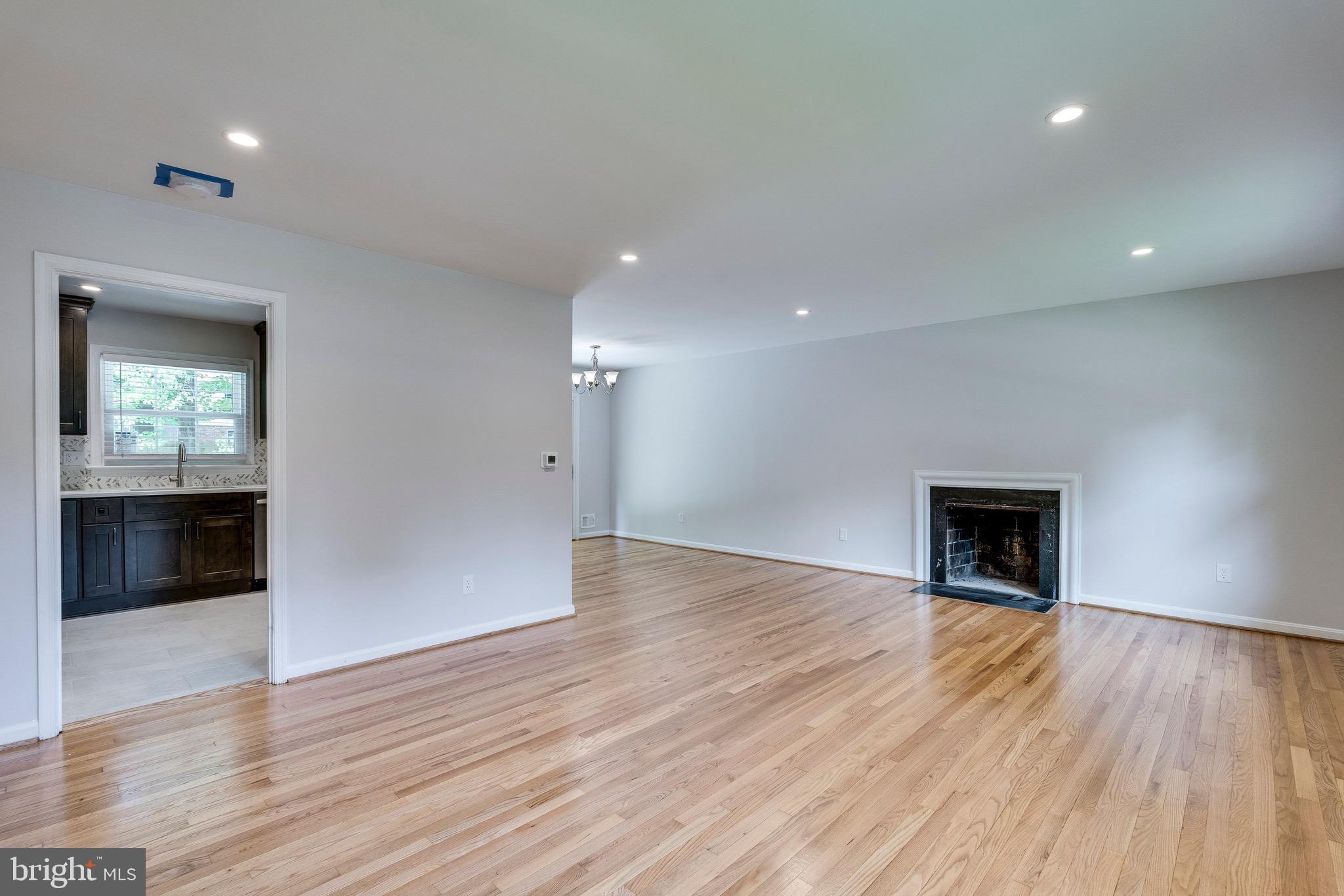 9808 Brixton Lane Bethesda, MD 20817 - Photo 11 of 24 wooden floor in an empty room with a window