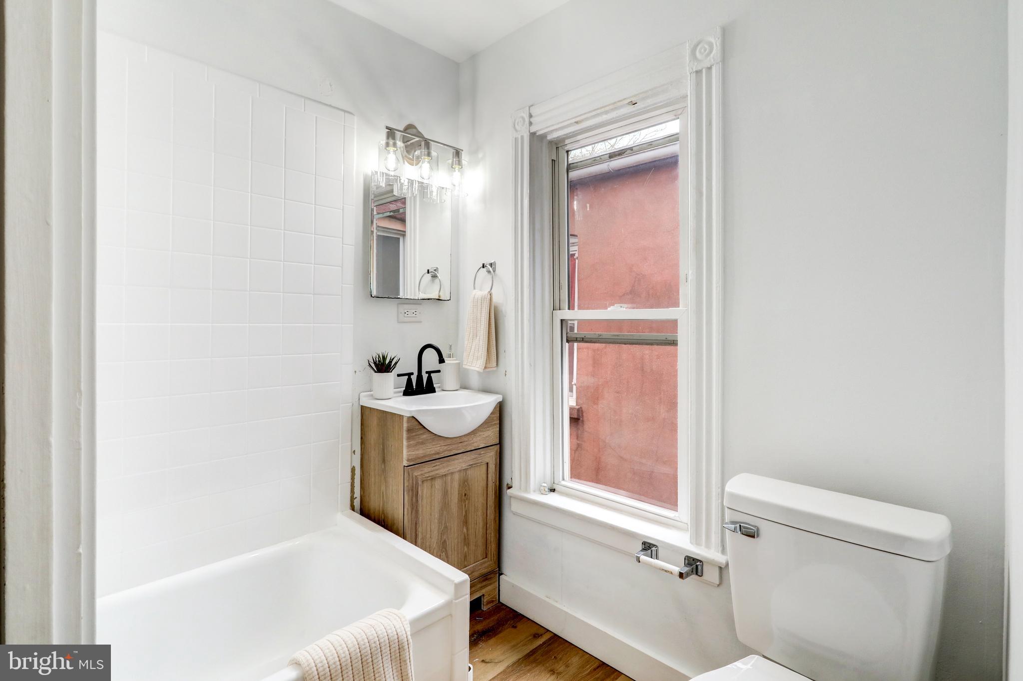 34 West New Street Lancaster, PA 17603 - Photo 23 of 31 a bathroom with a bathtub sink and toilet