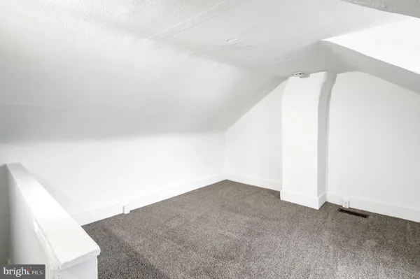 a view of a car parked in front of a building