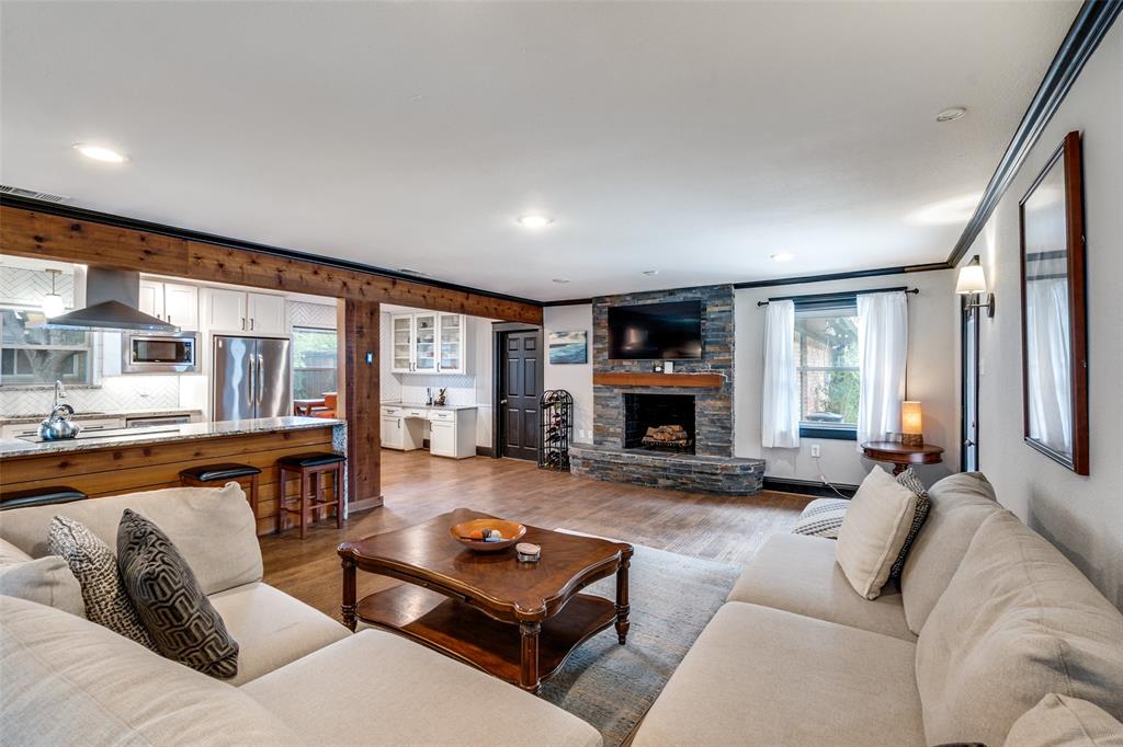 10355 Carry Back Circle Dallas, TX 75229 - Photo 15 of 37 a living room with furniture large window and a fireplace