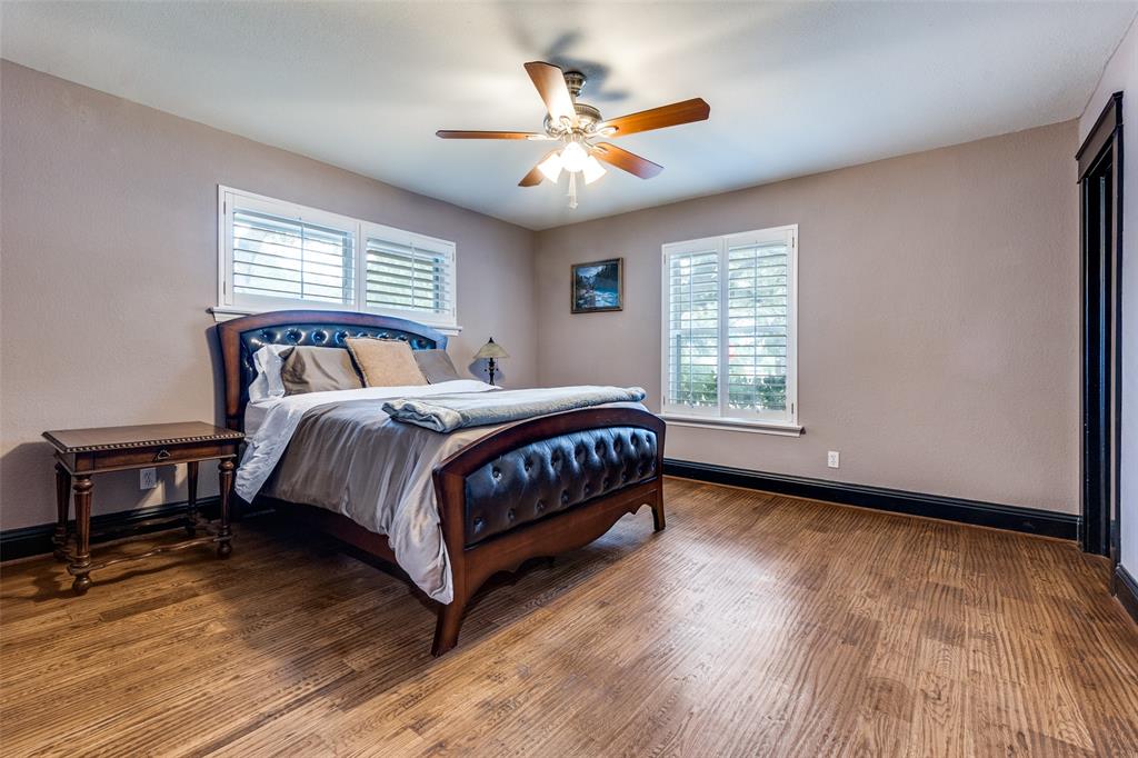 10355 Carry Back Circle Dallas, TX 75229 - Photo 21 of 37 a bedroom with a bed and window