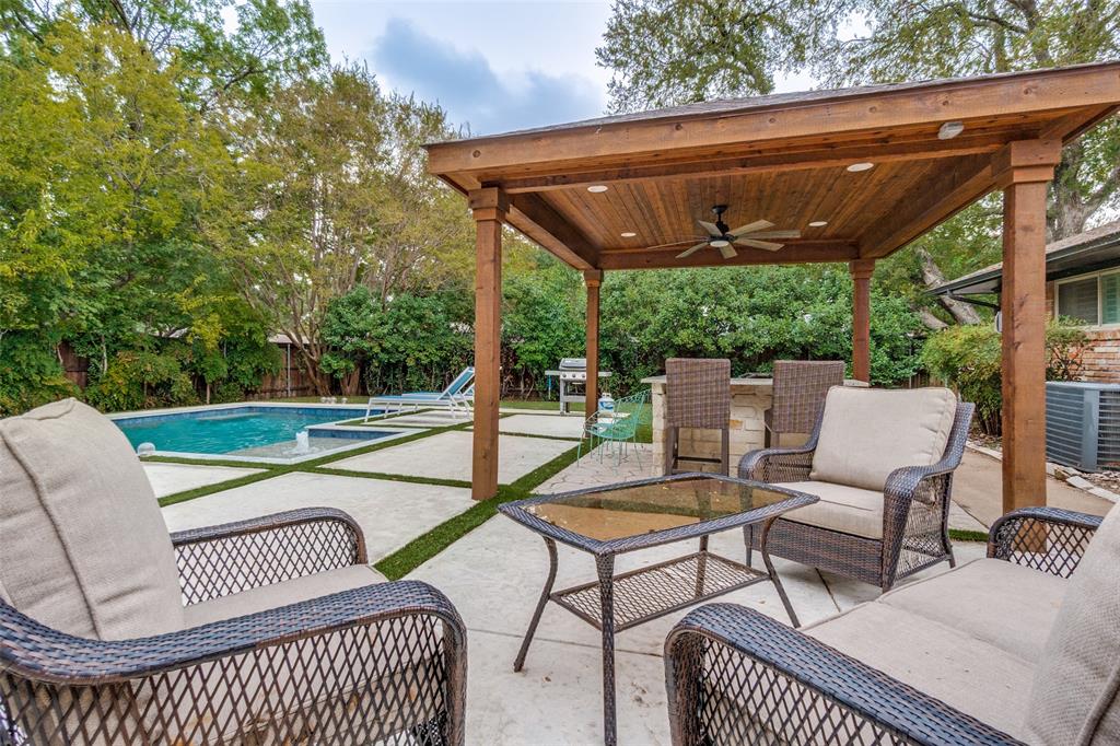 10355 Carry Back Circle Dallas, TX 75229 - Photo 30 of 35 a roof deck with a table and chairs