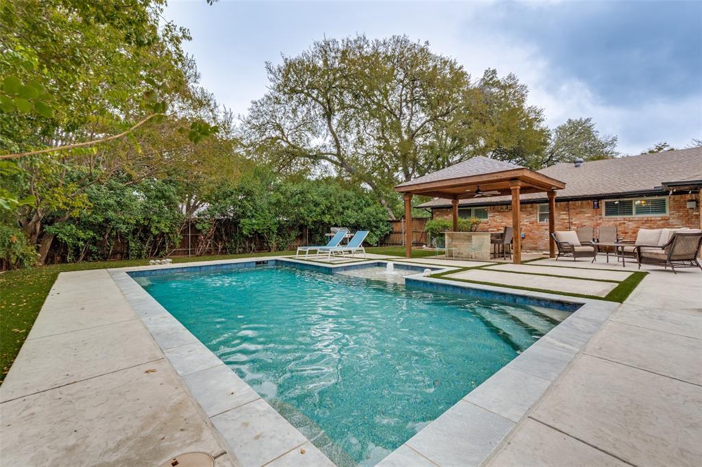 10355 Carry Back Circle Dallas, TX 75229 - Photo 31 of 35 a view of a swimming pool with lounge chair