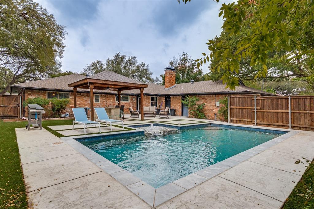 10355 Carry Back Circle Dallas, TX 75229 - Photo 32 of 35 swimming pool view with a seating space and a garden view