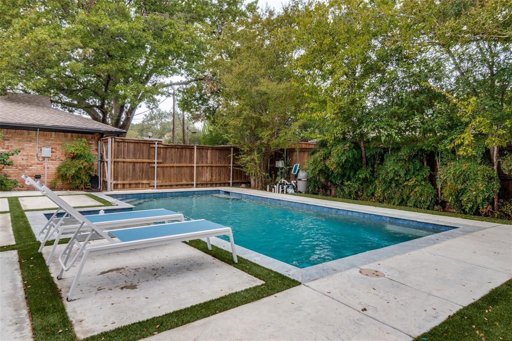 10355 Carry Back Circle Dallas, TX 75229 - Photo 33 of 35 a view of backyard with swimming pool and outdoor seating