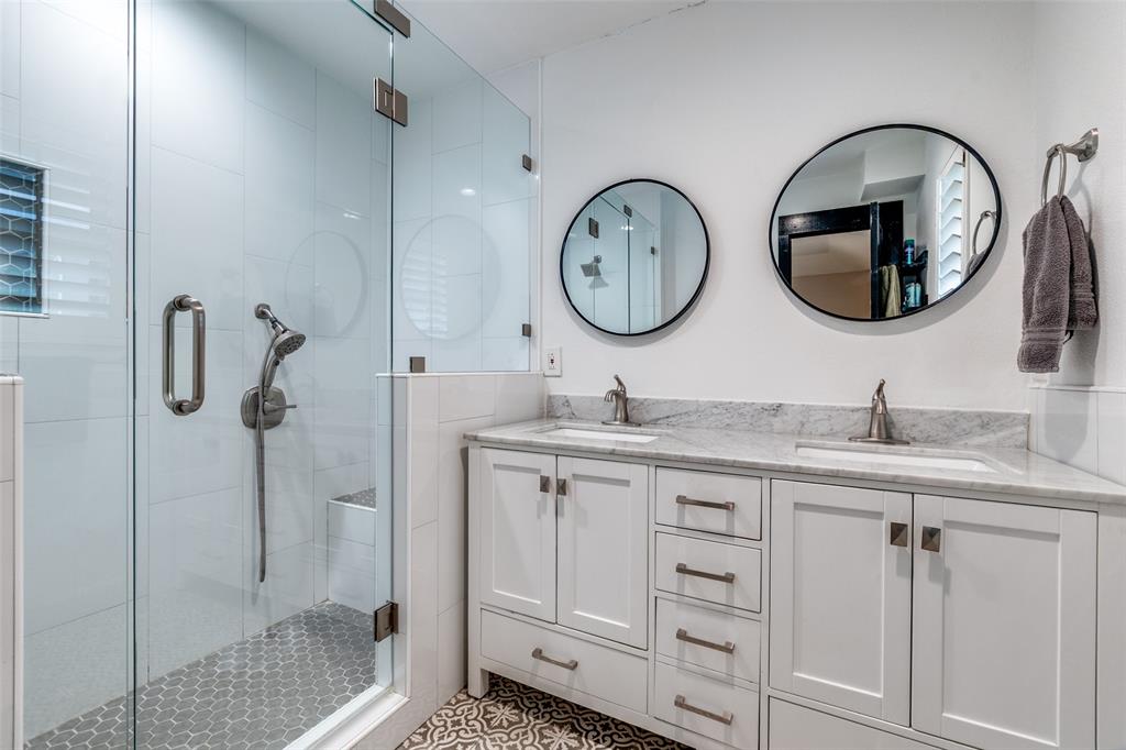 10355 Carry Back Circle Dallas, TX 75229 - Photo 4 of 35 a bathroom with a granite countertop sink and a mirror