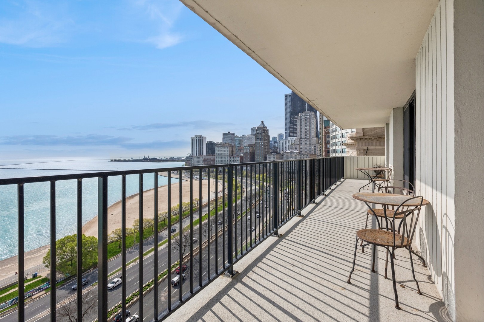 1212 North Lake Shore Drive, Unit 16BS Chicago, IL 60610 - Photo 16 of 26 a balcony with chairs and wooden floor