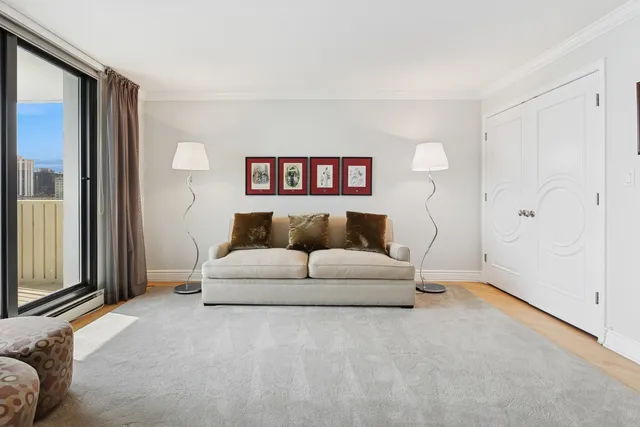 a spacious bedroom with a bed and a couch