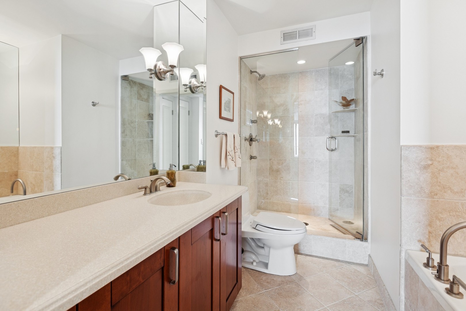 1212 North Lake Shore Drive, Unit 16BS Chicago, IL 60610 - Photo 22 of 26 a bathroom with a double vanity sink mirror double toilet and shower