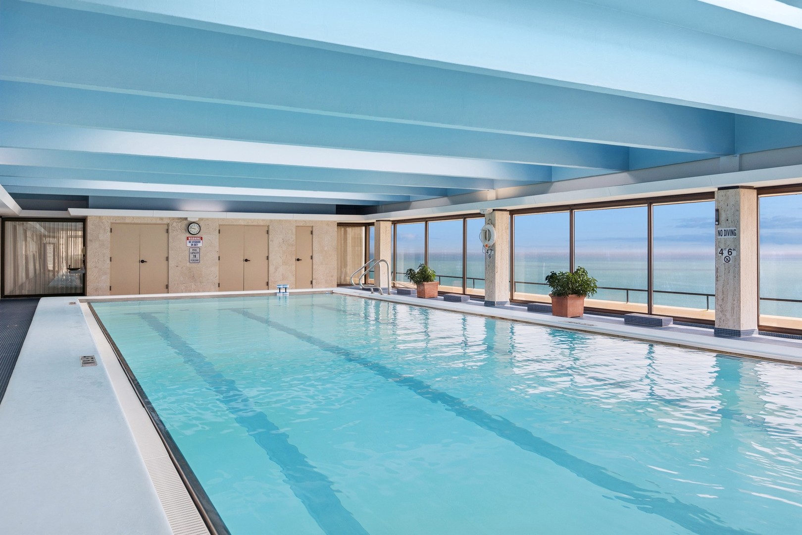 1212 North Lake Shore Drive, Unit 16BS Chicago, IL 60610 - Photo 24 of 26 a view of a living room and floor to ceiling window