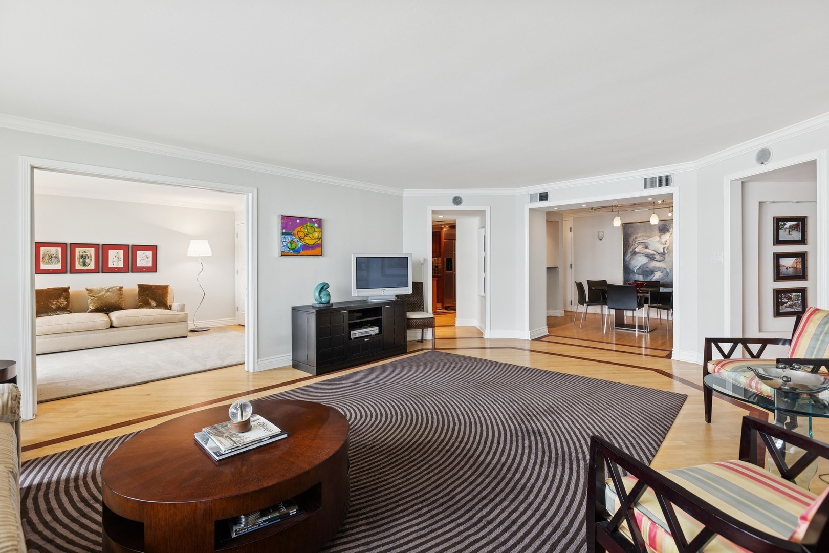 1212 North Lake Shore Drive, Unit 16BS Chicago, IL 60610 - Photo 8 of 26 a living room with furniture and a flat screen tv