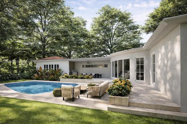 a front view of house with yard and outdoor seating