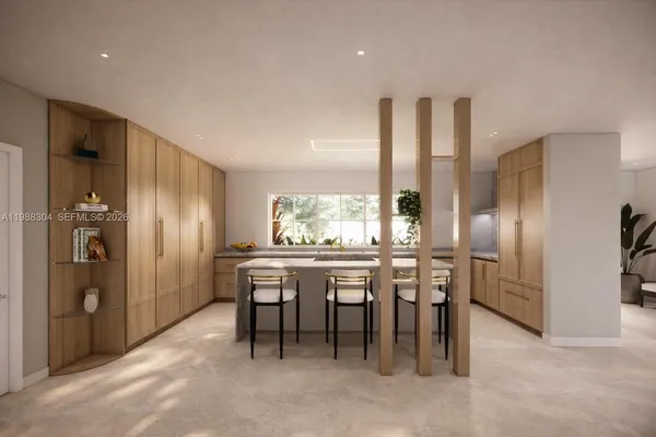 a kitchen with a refrigerator and table chair