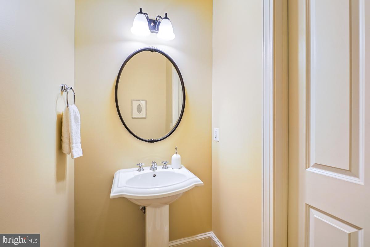 217 Talahi Road Southeast Vienna, VA 22180 - Photo 25 of 63 a bathroom with a sink and a mirror
