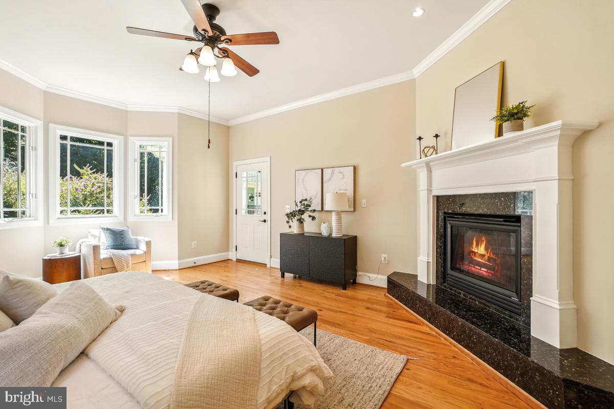 217 Talahi Road Southeast Vienna, VA 22180 - Photo 27 of 63 a bedroom with a bed and a fireplace