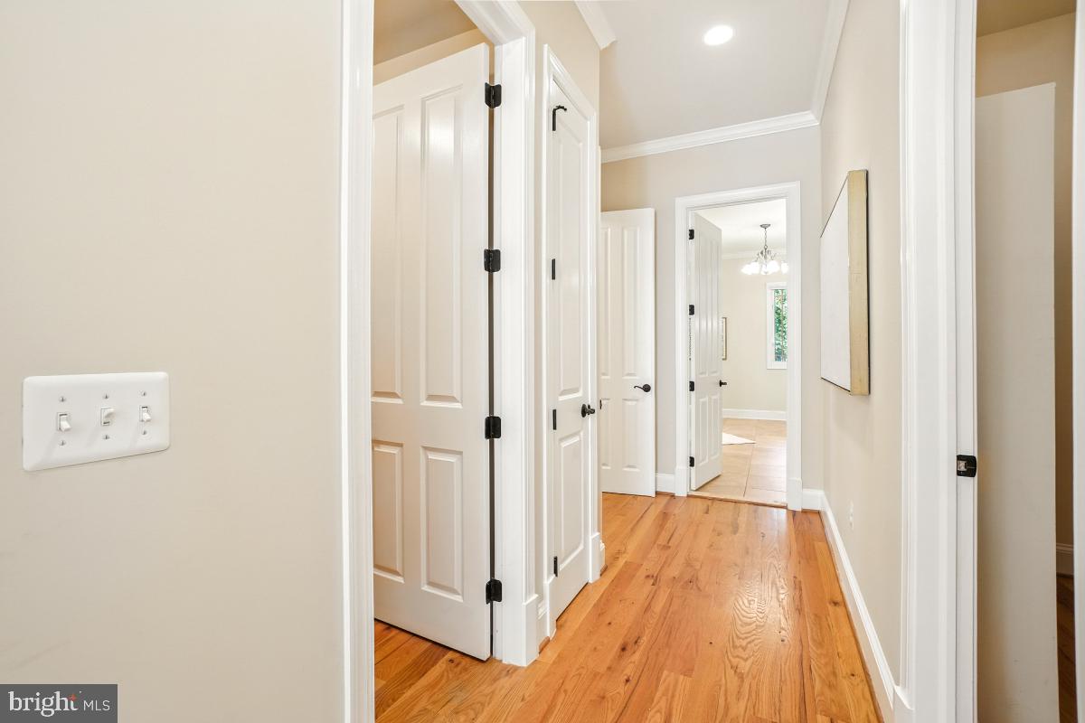 217 Talahi Road Southeast Vienna, VA 22180 - Photo 29 of 63 a view of a hallway with wooden floor and closet area