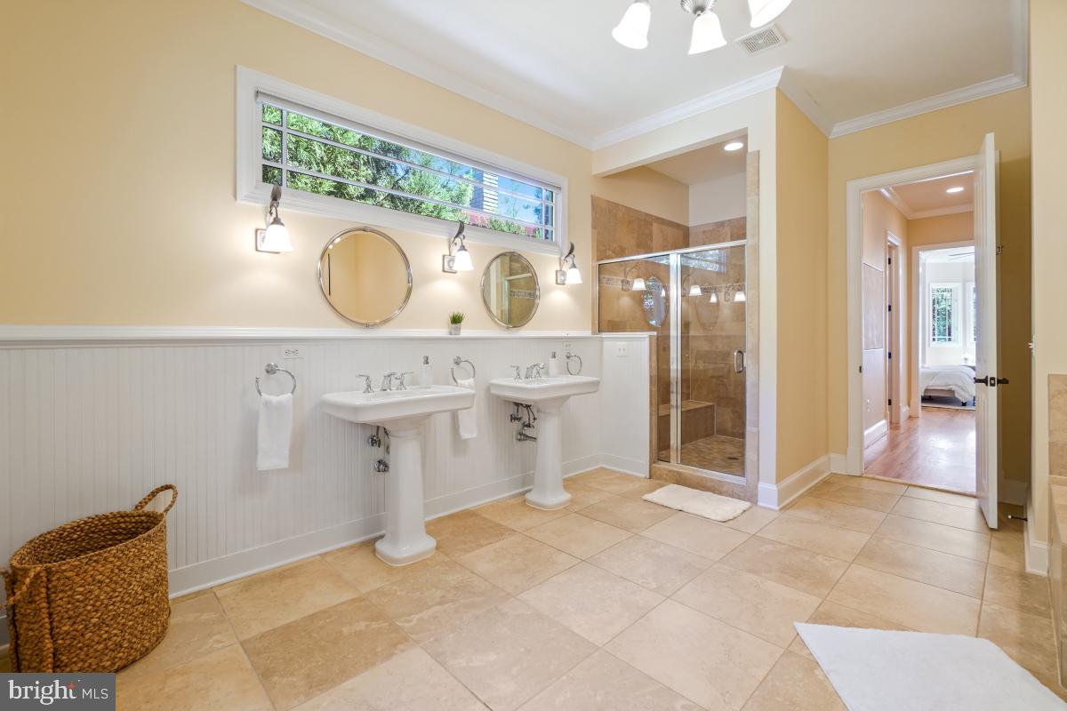 217 Talahi Road Southeast Vienna, VA 22180 - Photo 32 of 63 a spacious bathroom with a sink mirror vanity and toilet