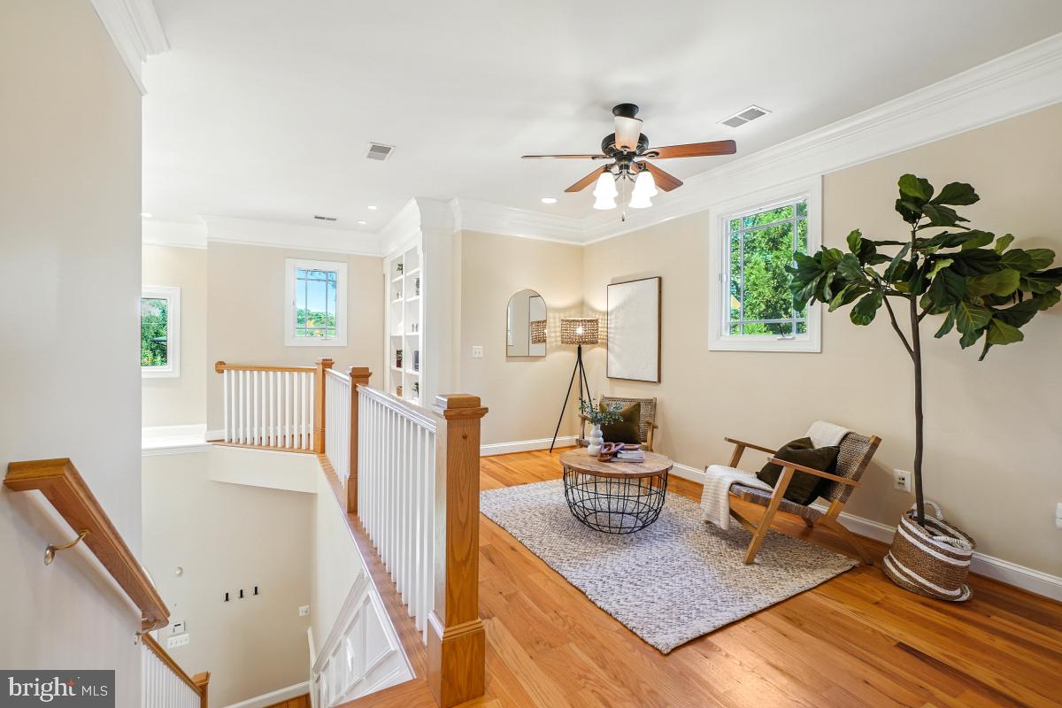 217 Talahi Road Southeast Vienna, VA 22180 - Photo 34 of 63 a living room with furniture and a chandelier