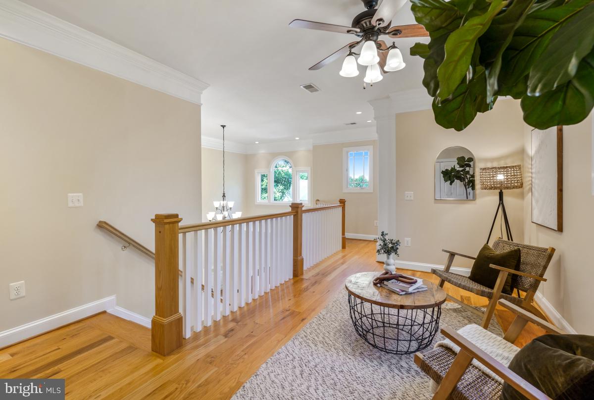217 Talahi Road Southeast Vienna, VA 22180 - Photo 35 of 63 a living room with furniture and a chandelier