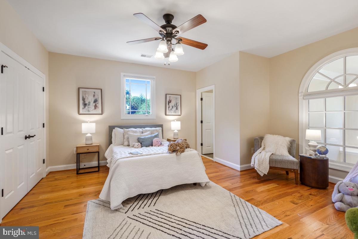 217 Talahi Road Southeast Vienna, VA 22180 - Photo 37 of 63 a bedroom with a bed and wooden floor