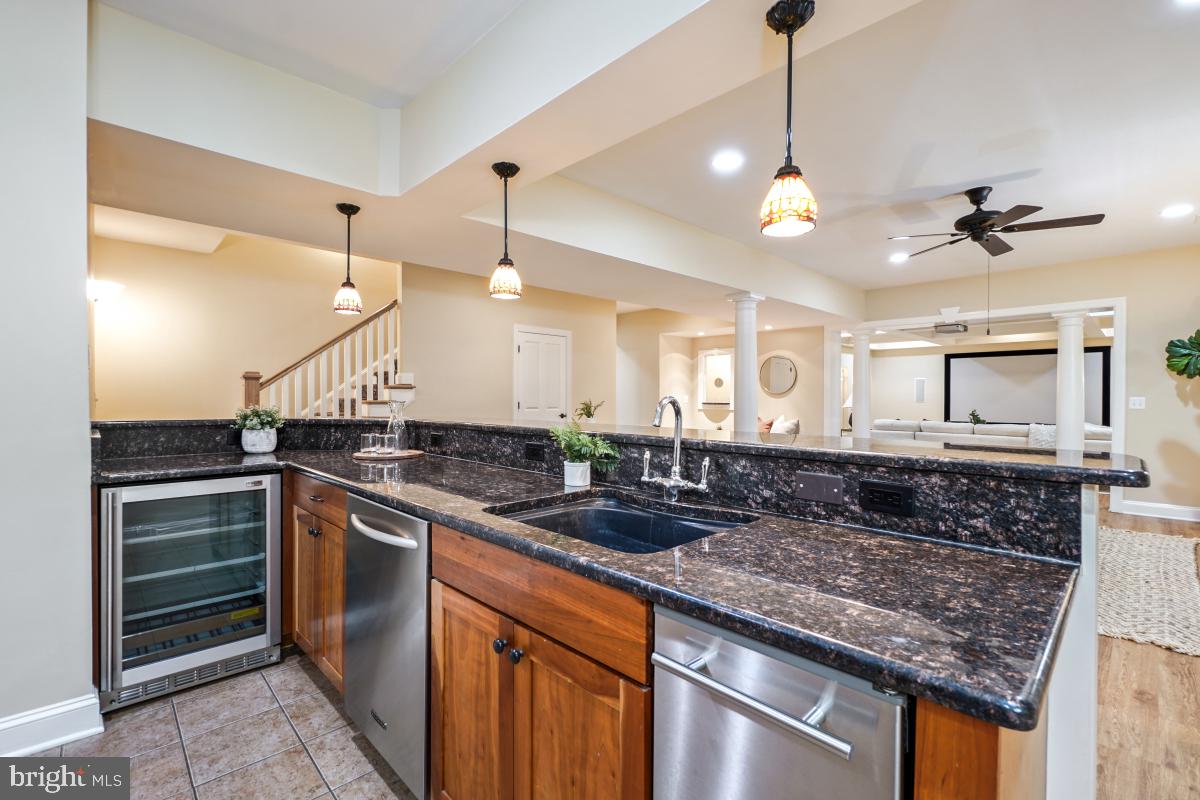 217 Talahi Road Southeast Vienna, VA 22180 - Photo 49 of 63 a kitchen with stainless steel appliances granite countertop a sink and stove