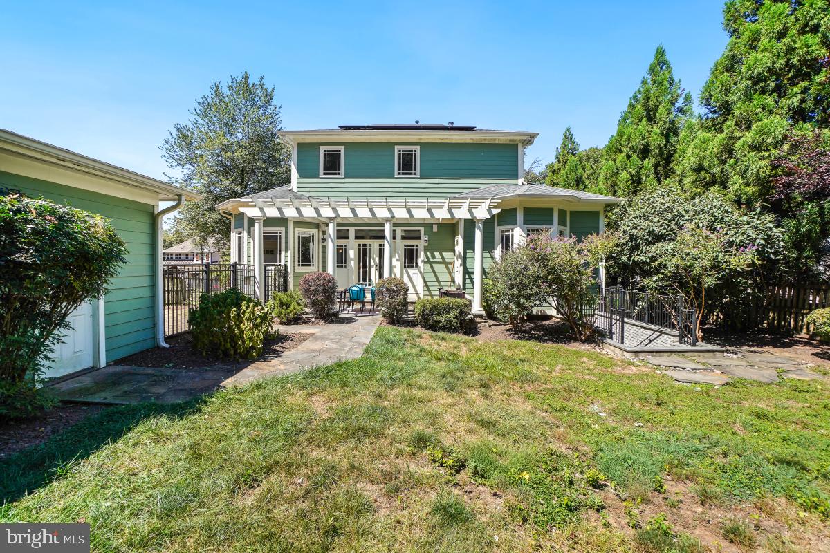 217 Talahi Road Southeast Vienna, VA 22180 - Photo 58 of 63 a front view of a house with a yard garage and outdoor seating