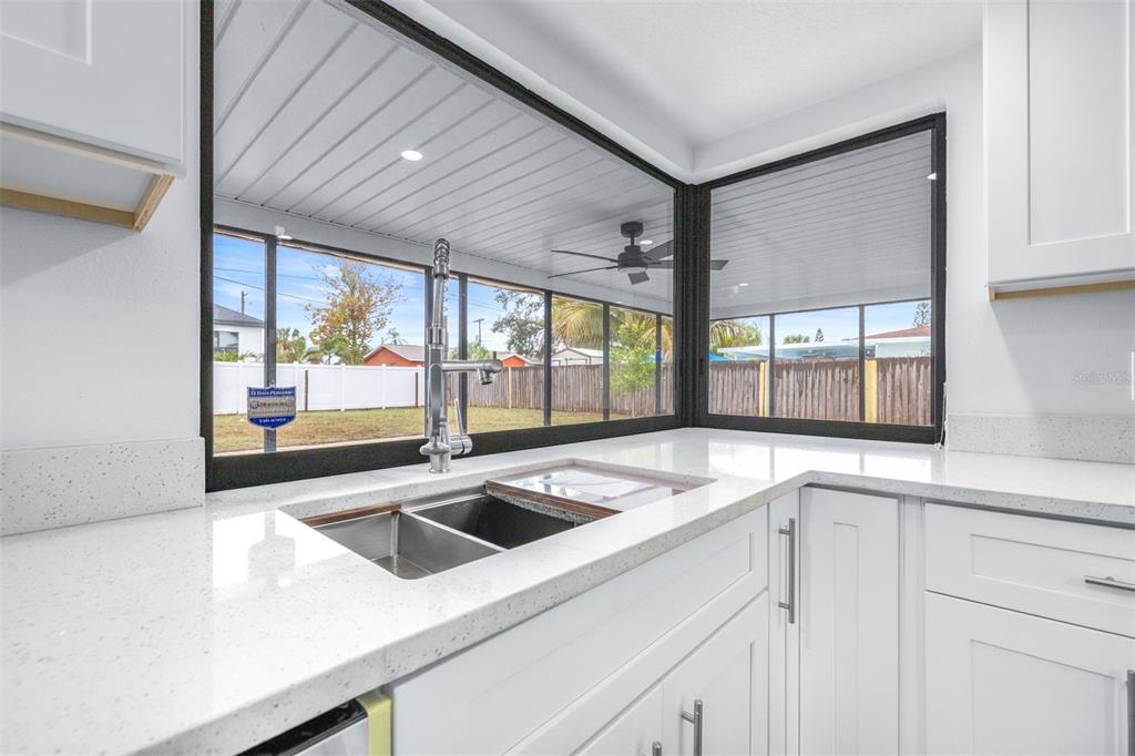 6312 Fairway Boulevard Apollo Beach, FL 33572 - Photo 15 of 58 a kitchen with a sink and large window