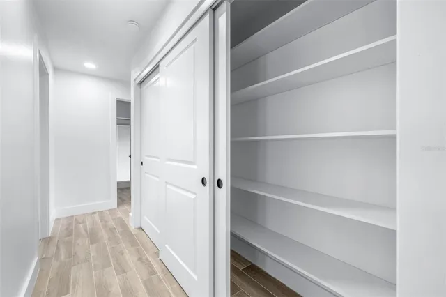 a view of a hallway with closet