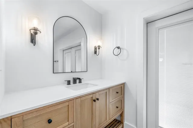 a bathroom with a shower toilet and sink