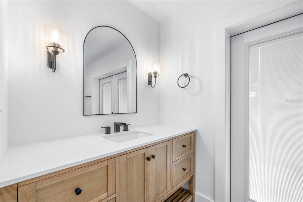 6312 Fairway Boulevard Apollo Beach, FL 33572 - Photo 26 of 58 a bathroom with a double vanity sink and mirror